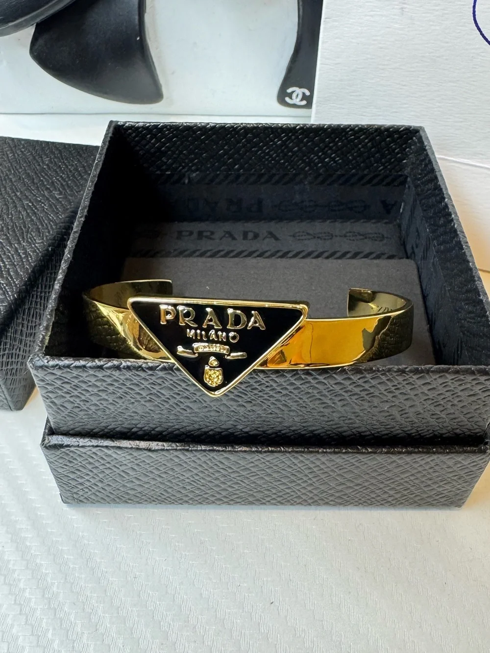 Prada polished gold